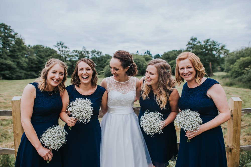 bride laughing with bridesmaid