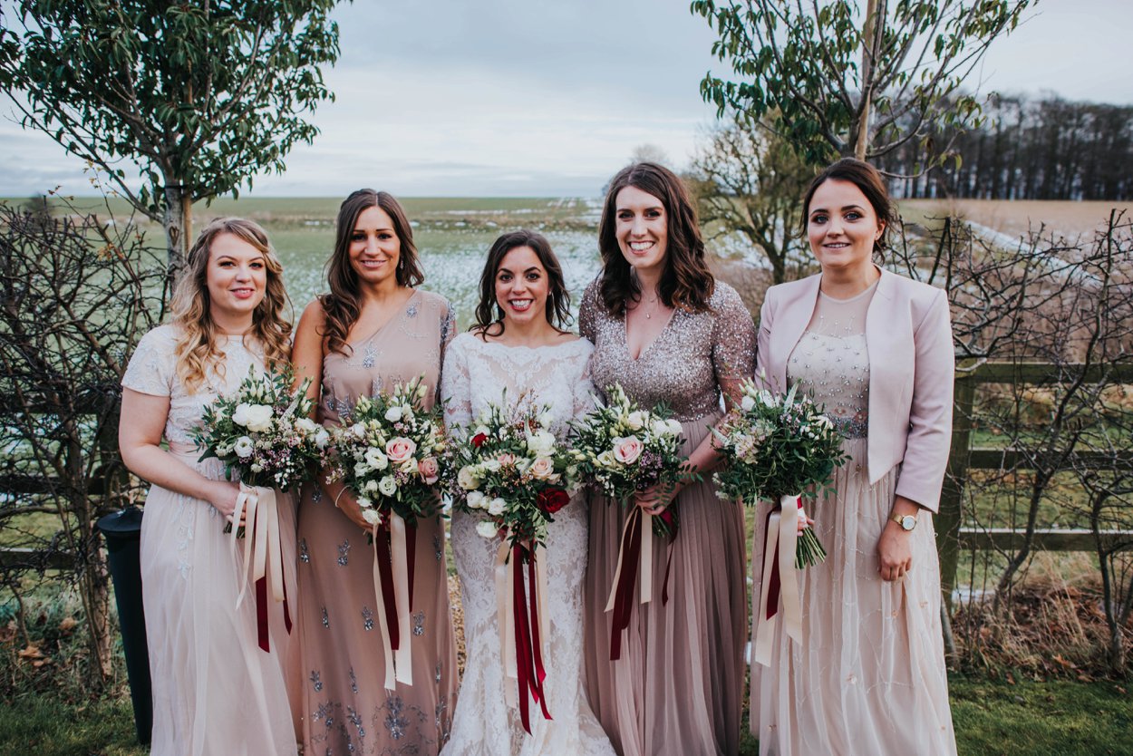 girls in blush dresses wedding day